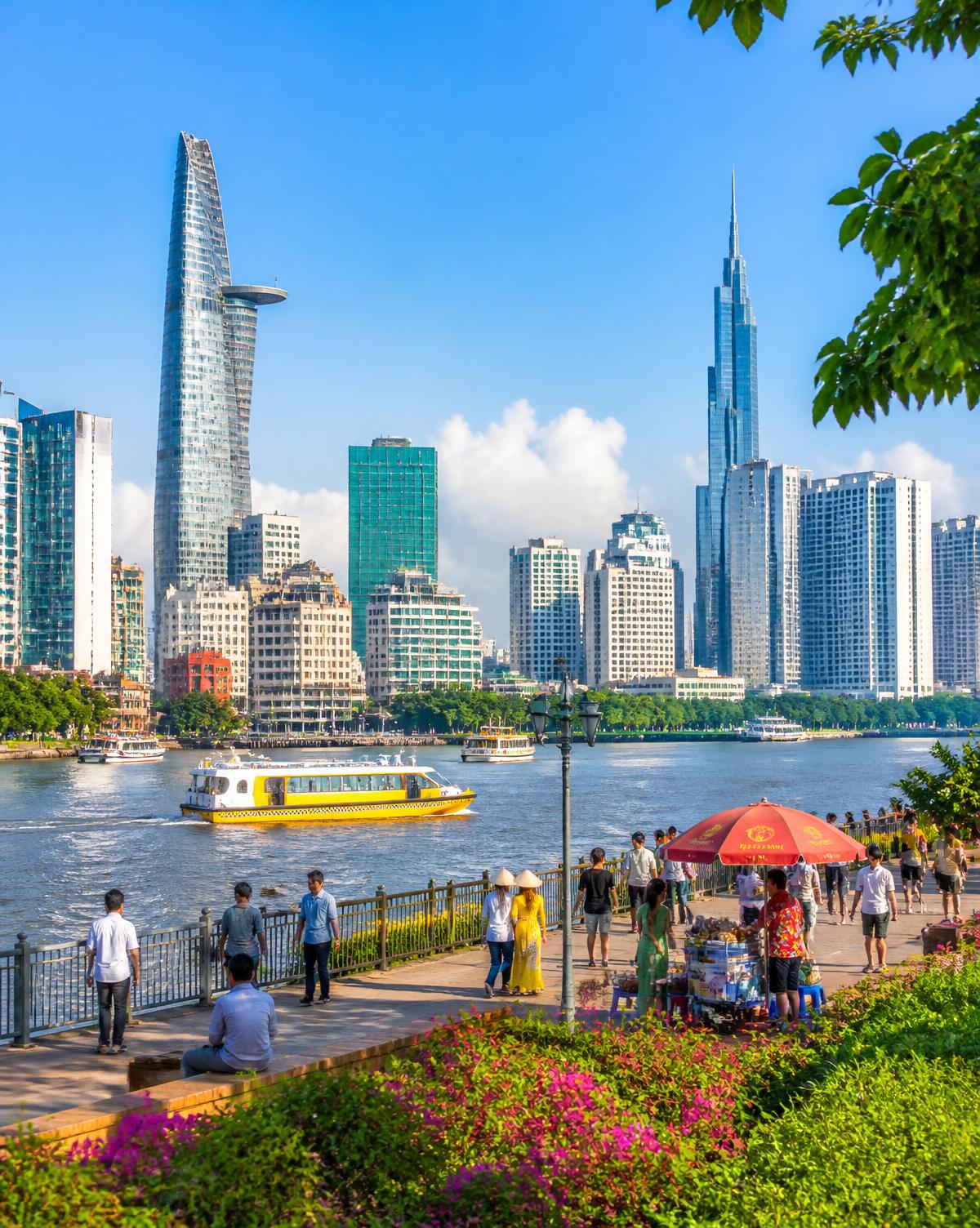 Ho Chi Minh City skyline along the Saigon River with Bitexco Tower and Landmark 81